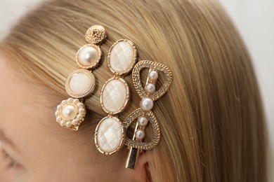 Photo of Woman with beautiful hair clips, closeup view