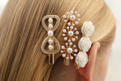 Photo of Woman with beautiful hair clips, closeup view