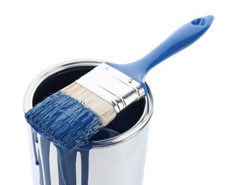 Photo of Can of blue paint and brush isolated on white