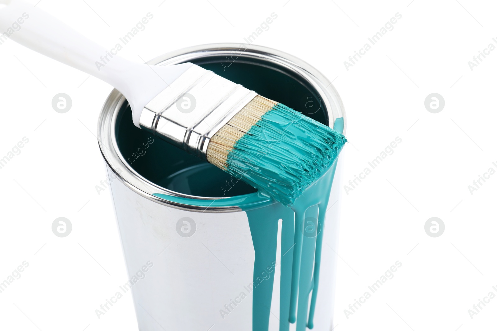 Photo of Can of turquoise paint and brush isolated on white