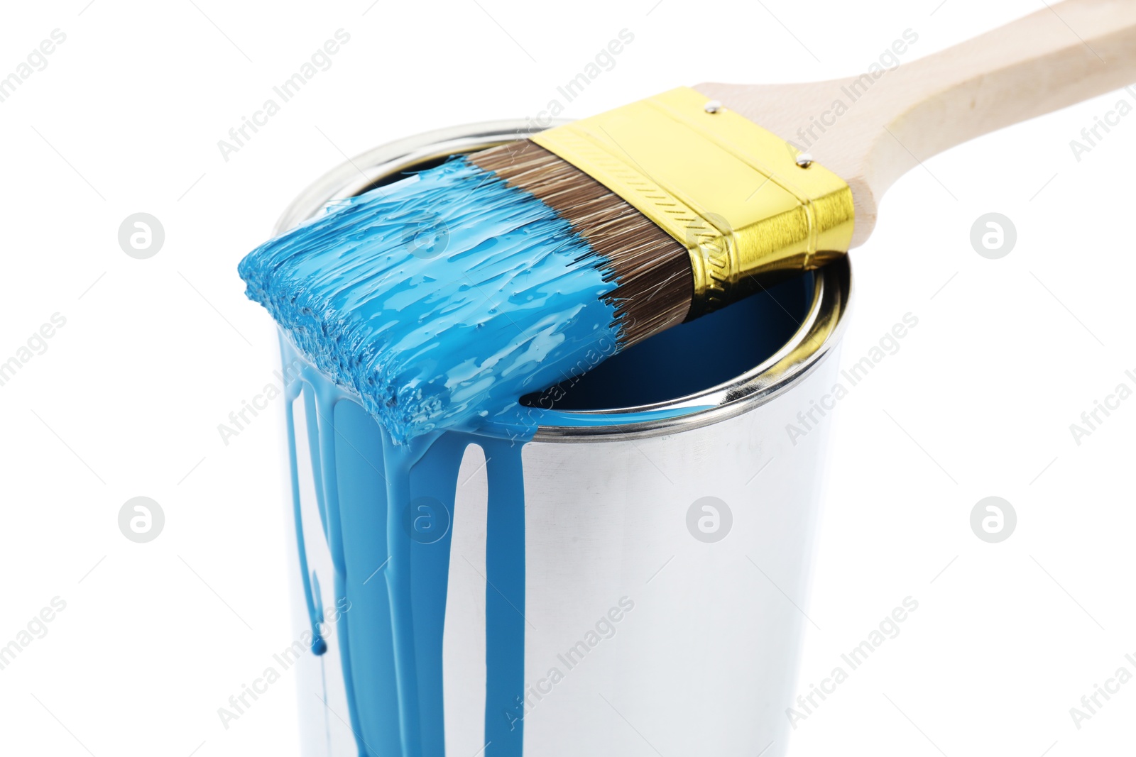 Photo of Can of light blue paint and brush isolated on white