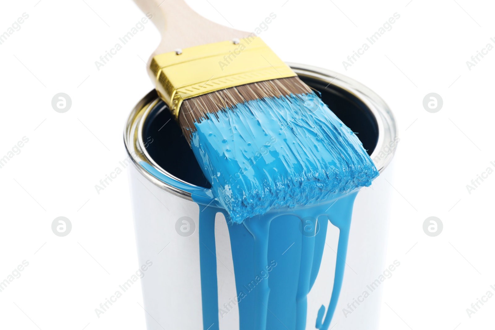 Photo of Can of light blue paint and brush isolated on white