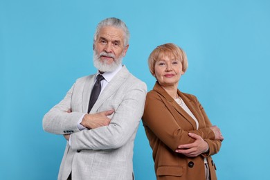 Photo of Portrait of lovely senior couple on light blue background