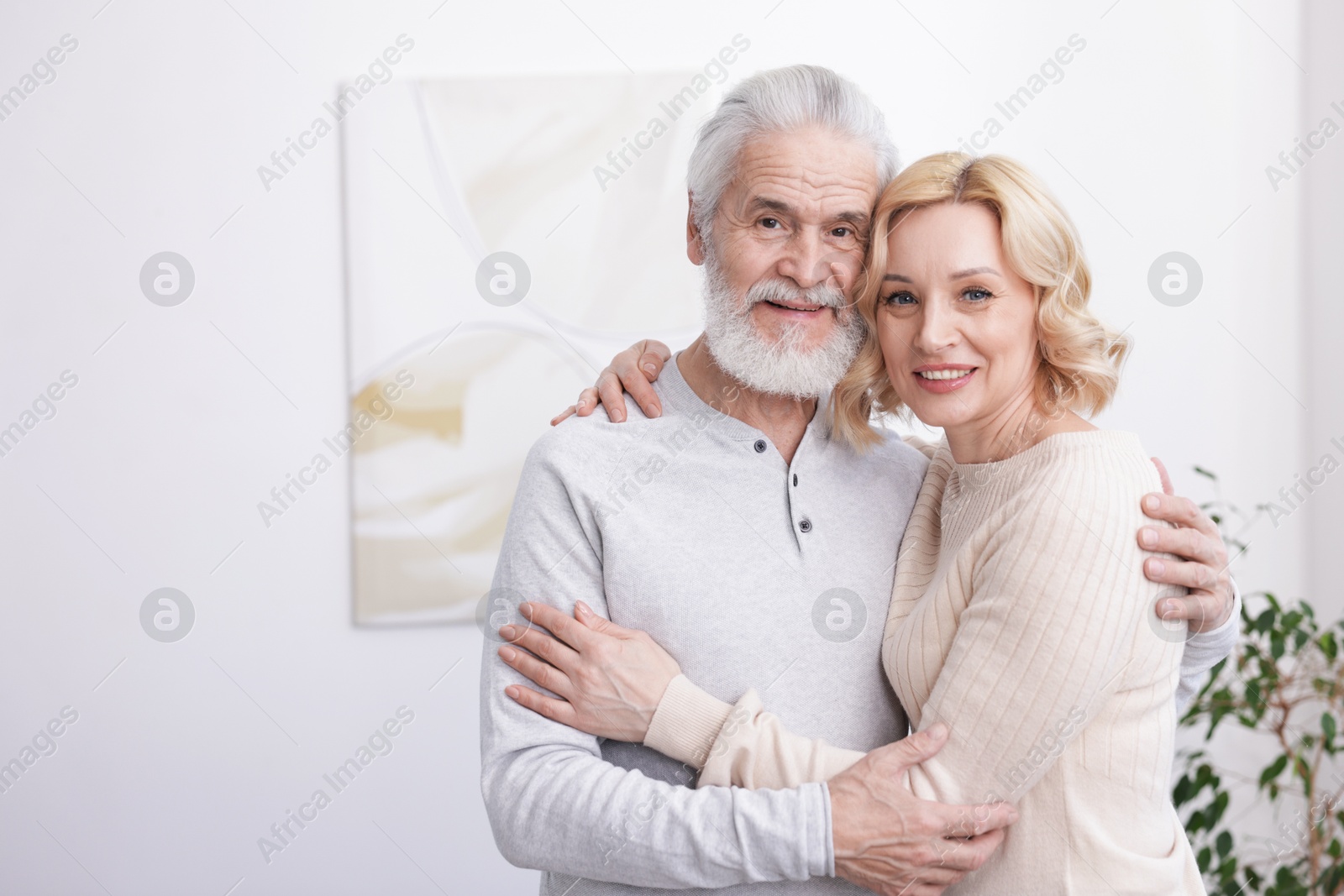 Photo of Senior man and mature woman at home. Happy couple