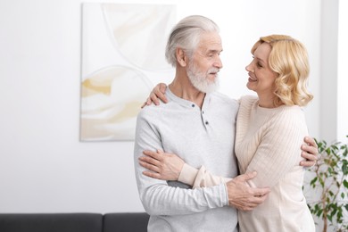 Photo of Senior man and mature woman at home. Happy couple