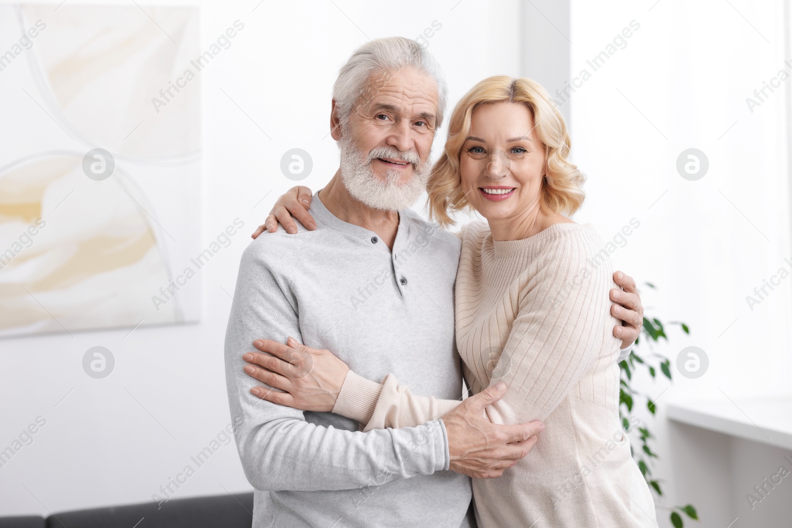 Photo of Senior man and mature woman at home. Happy couple