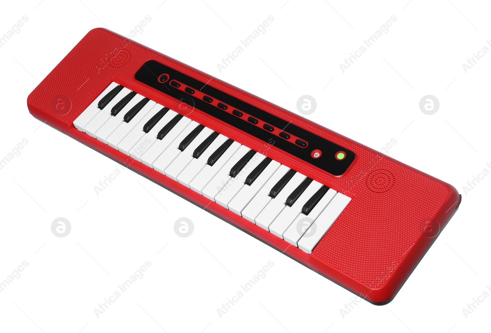 Photo of Red toy electric piano isolated on white. Child's musical instrument