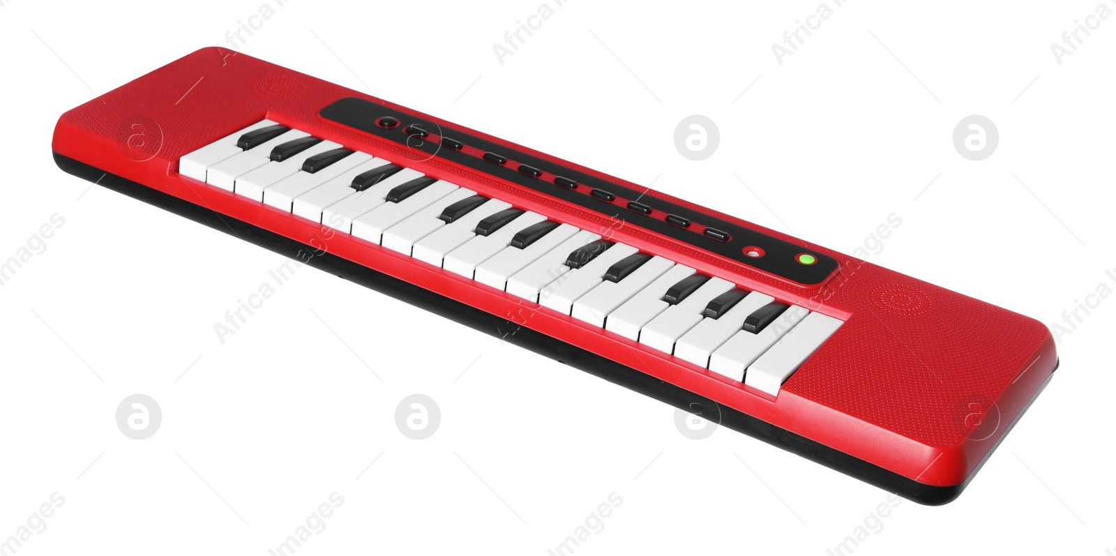 Photo of Red toy electric piano isolated on white. Child's musical instrument