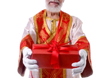 Photo of Saint Nicholas giving gift on white background, closeup