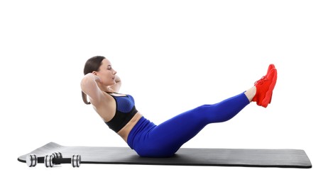 Photo of Woman in sportswear exercising on white background