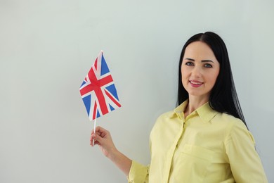 Photo of English teacher with UK flag on white background