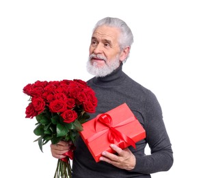 Photo of Senior man with bouquet of red roses and gift box on white background