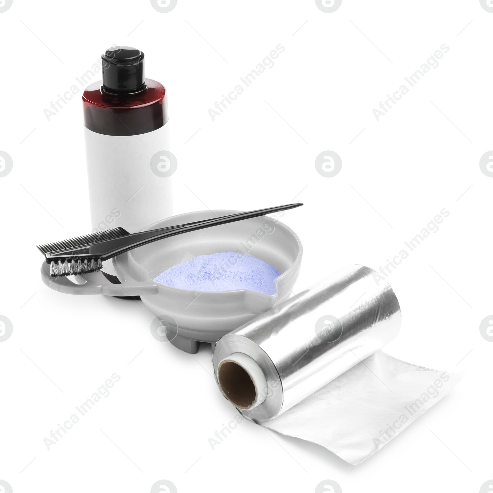 Bleaching powder and hairdresser's tools isolated on white Photo of Bleaching powder and hairdresser's tools isolated on white