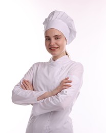 Photo of Portrait of confectioner in uniform with crossed arms on white background