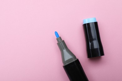 Photo of One color marker on pink background, top view