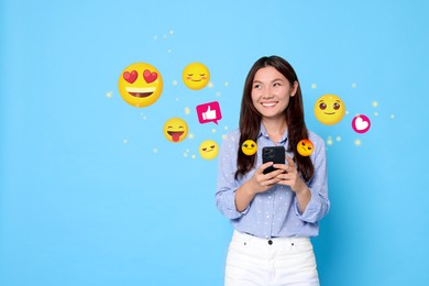 Image of Social media. Happy woman using mobile phone on light blue background. Different notification signs and emojis near gadget