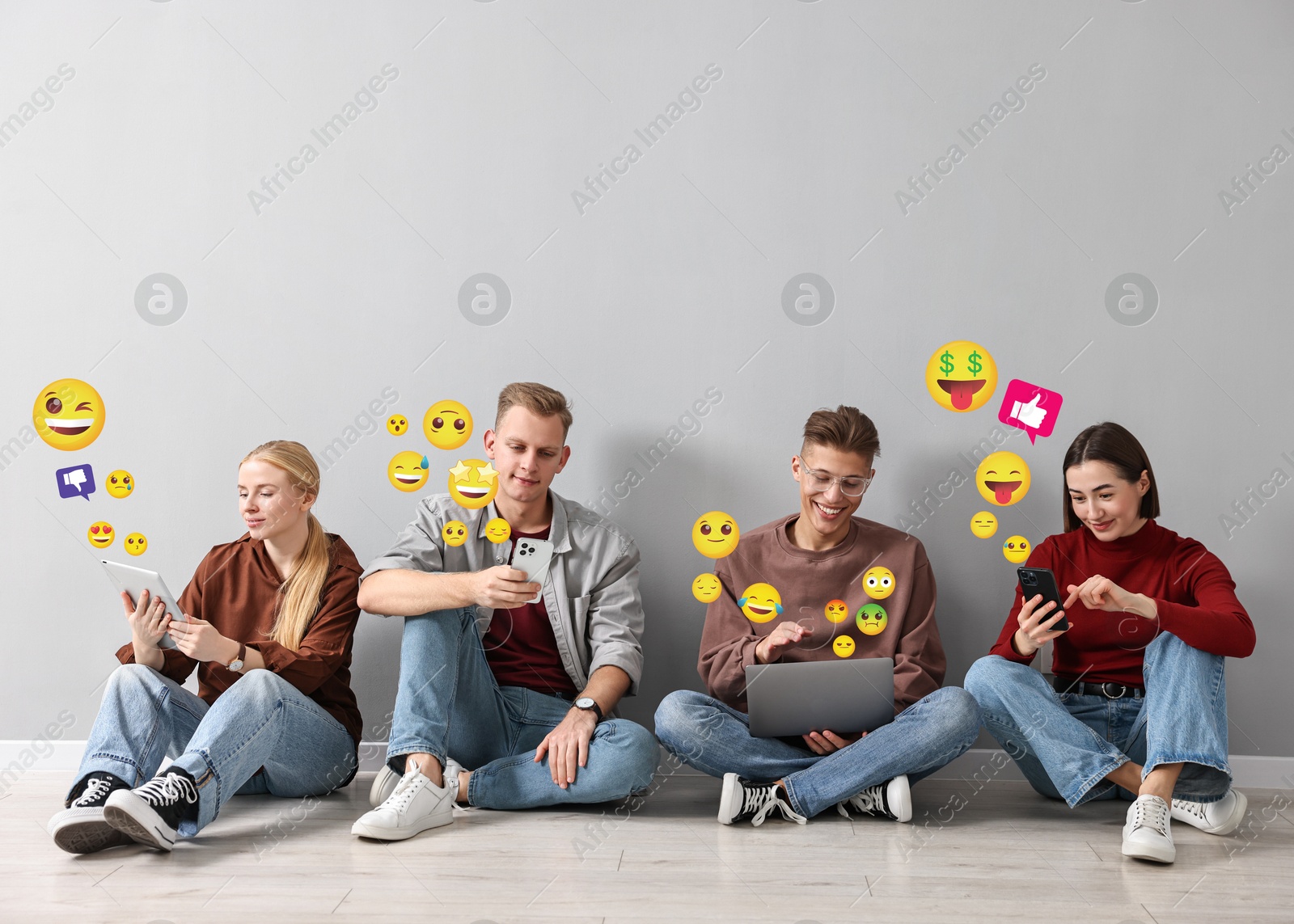 Image of Social media. Group of young people using different gadgets on light grey background. Different notification signs and emojis near them