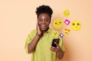 Image of Social media. Surprised woman using mobile phone on beige background. Different notification signs and emojis near gadget