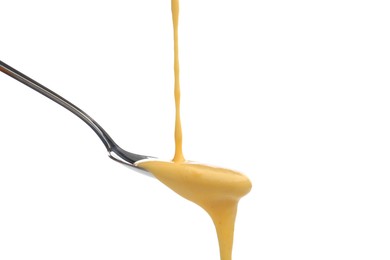 Photo of Delicious melted cheese flowing down onto spoon isolated on white