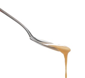 Photo of Delicious melted cheese flowing down from spoon isolated on white