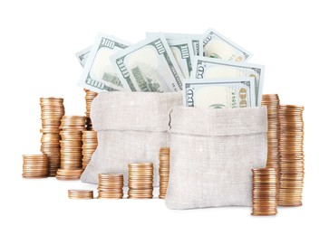 Image of Wealth. Stacked coins and burlap bags full of dollar bills isolated on white
