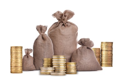 Image of Wealth. Stacked coins and burlap bags isolated on white