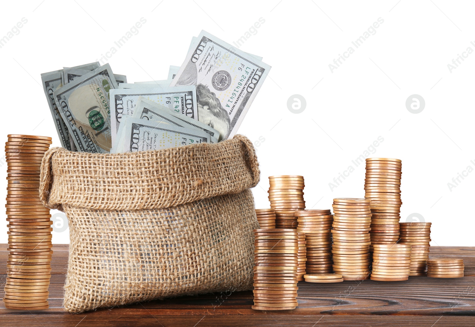 Wealth. Stacked coins and burlap bag full of dollar bills isolated on white Image of Wealth. Stacked coins and burlap bag full of dollar bills isolated on white
