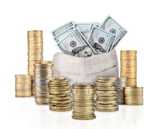 Image of Wealth. Stacked coins and burlap bag full of dollar bills isolated on white