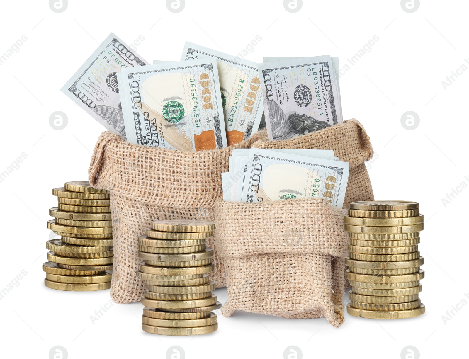 Wealth. Stacked coins and burlap bags full of dollar bills isolated on white Image of Wealth. Stacked coins and burlap bags full of dollar bills isolated on white