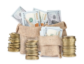 Image of Wealth. Stacked coins and burlap bags full of dollar bills isolated on white