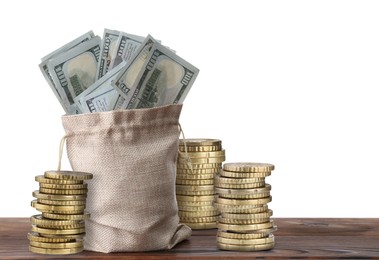 Image of Wealth. Stacked coins and burlap bag full of dollar bills isolated on white