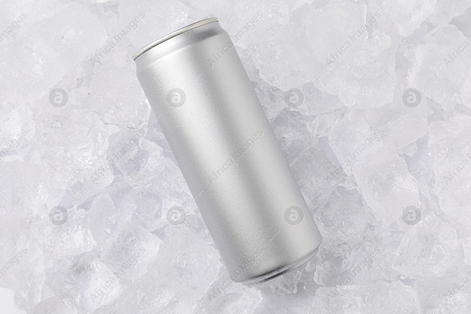Refreshing drink in can on ice cubes, top view Photo of Refreshing drink in can on ice cubes, top view