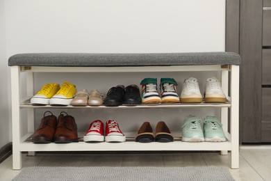 Photo of Shoe storage bench with different footwear indoors