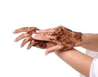Photo of Woman applying body scrub onto her hands on white background, closeup
