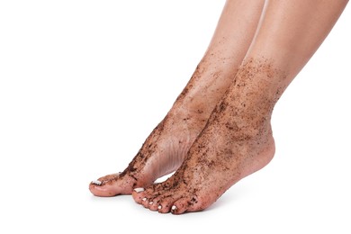 Photo of Woman with body scrub on her feet against white background, closeup