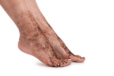 Photo of Woman with body scrub on her feet against white background, closeup