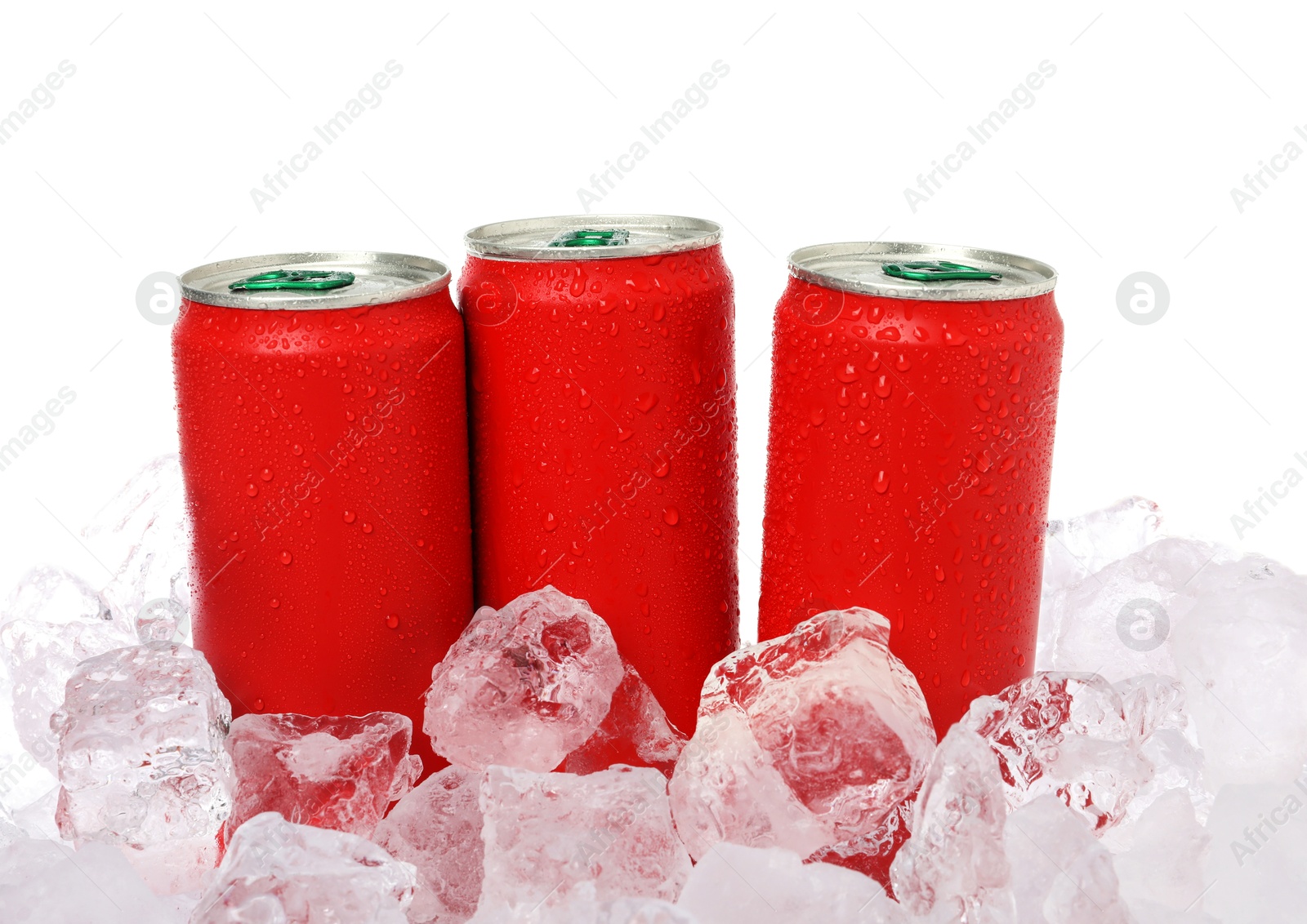 Refreshing drinks in cans on ice cubes against white background Photo of Refreshing drinks in cans on ice cubes against white background