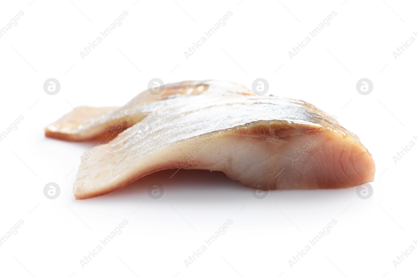 Pieces of delicious herring isolated on white Photo of Pieces of delicious herring isolated on white