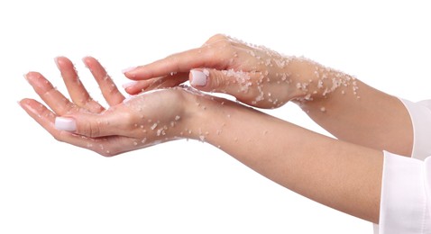 Photo of Woman applying body scrub onto her hands on white background, closeup