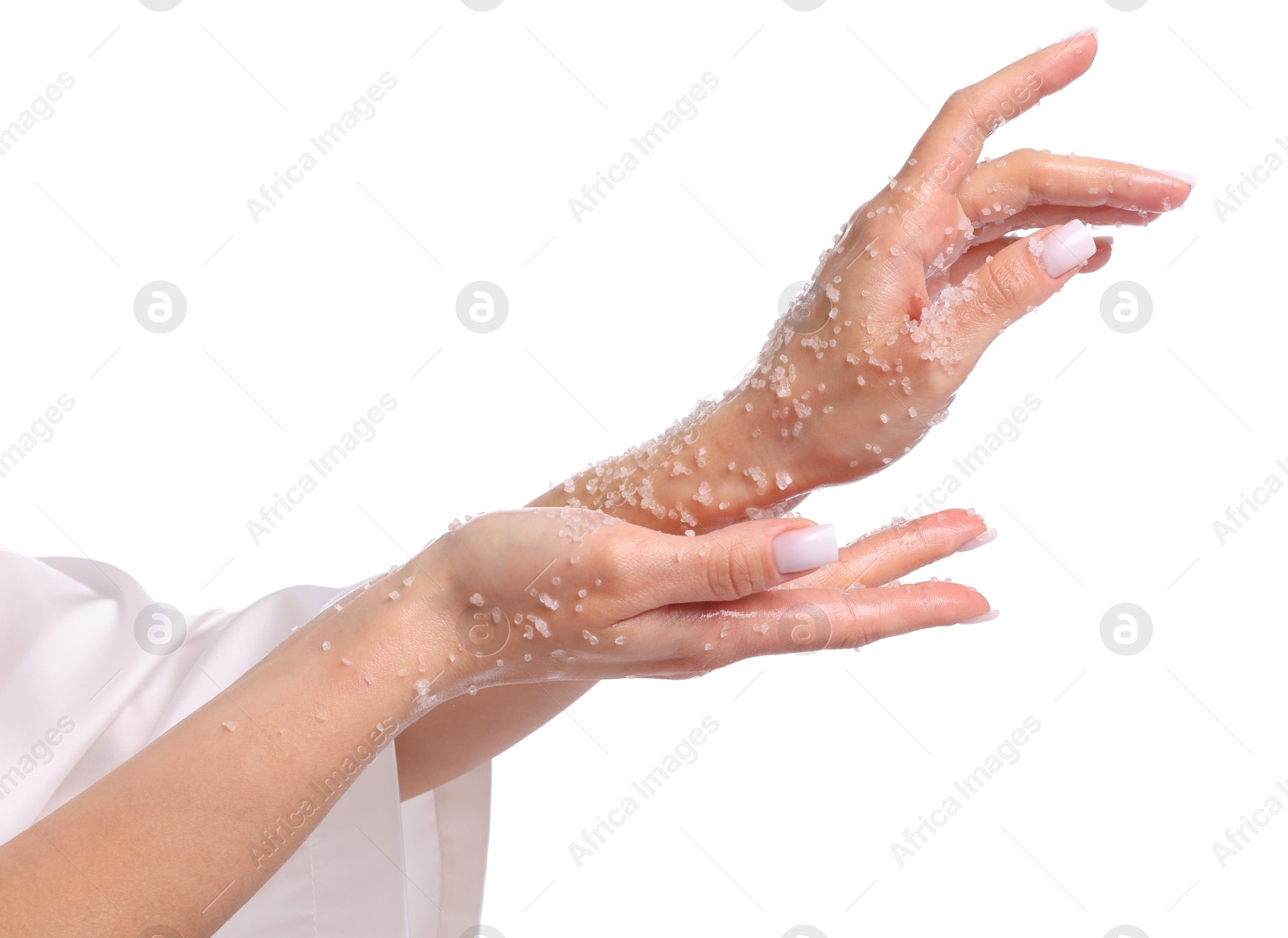 Woman applying body scrub onto her hands on white background, closeup Photo of Woman applying body scrub onto her hands on white background, closeup