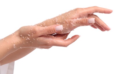 Photo of Woman applying body scrub onto her hands on white background, closeup