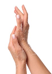 Photo of Woman applying body scrub onto her hands on white background, closeup
