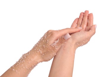 Photo of Woman applying body scrub onto her hands on white background, closeup