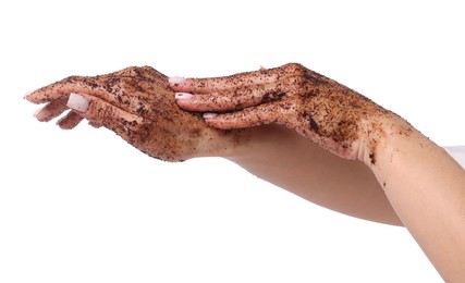Photo of Woman applying body scrub onto her hands on white background, closeup