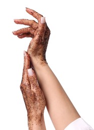 Photo of Woman applying body scrub onto her hands on white background, closeup