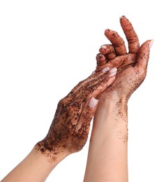 Photo of Woman applying body scrub onto her hands on white background, closeup