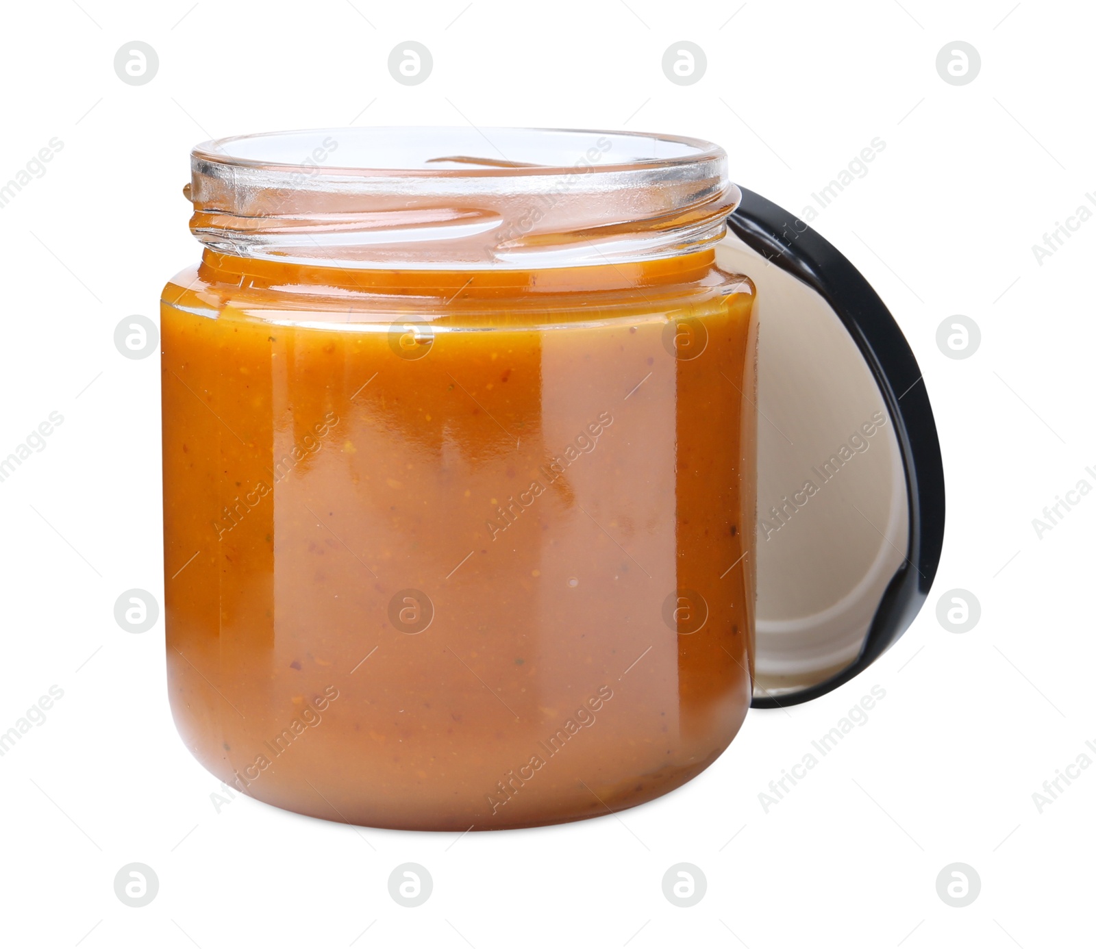 Tasty curry sauce in glass jar isolated on white Photo of Tasty curry sauce in glass jar isolated on white