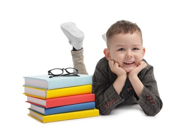 Photo of Cute little boy, books and glasses on white background