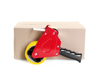Photo of Dispenser with adhesive tape on cardboard box against white background