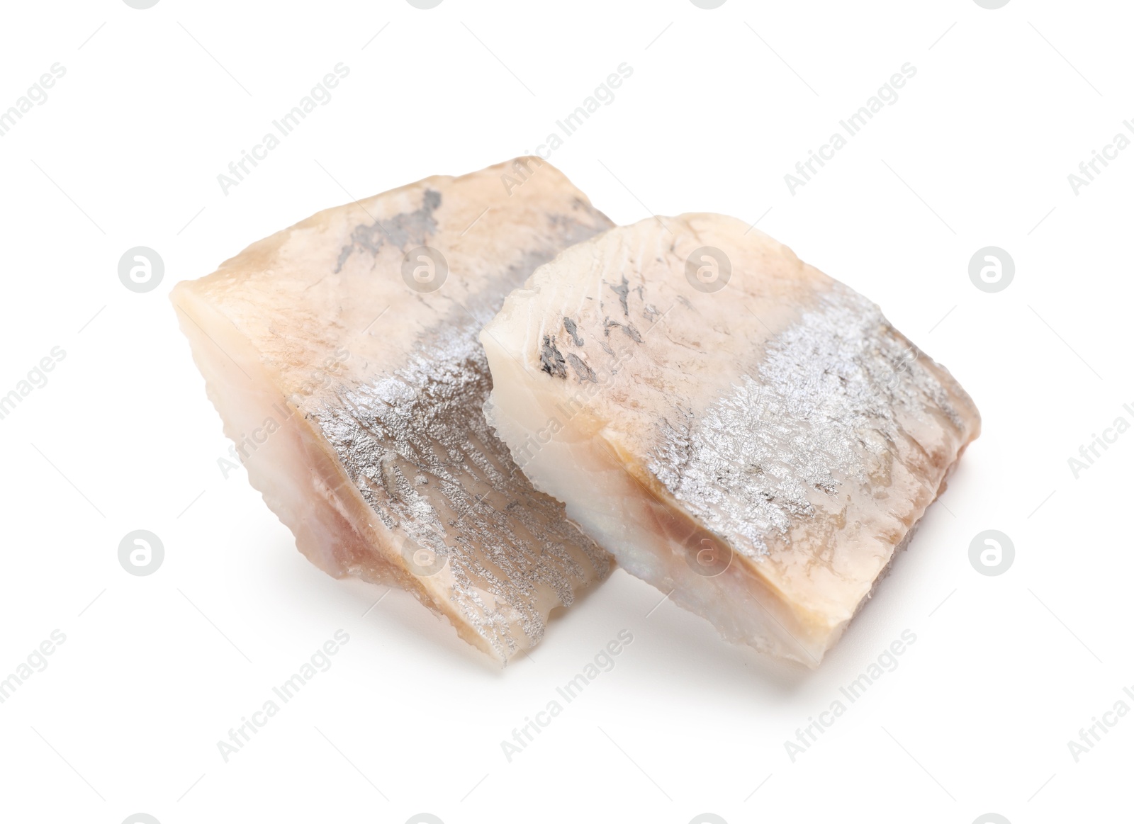 Pieces of delicious herring isolated on white Photo of Pieces of delicious herring isolated on white